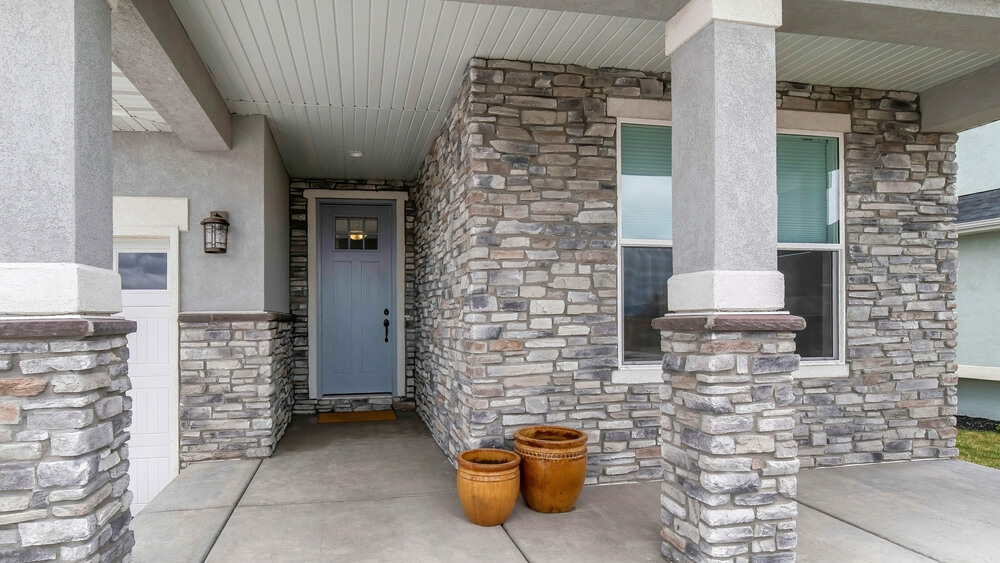 Panorama,House,Exterior,With,Stone,Veneer,Siding,And,Garage