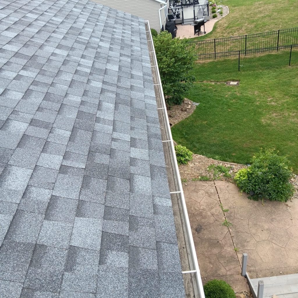 Brand new roof and gutters with a white and gray roof with white gutters in Cuyahoga falls OH.