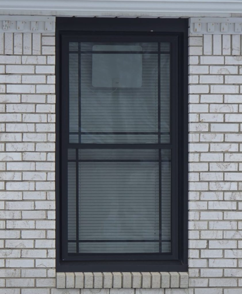 A black window on a snowy day.
